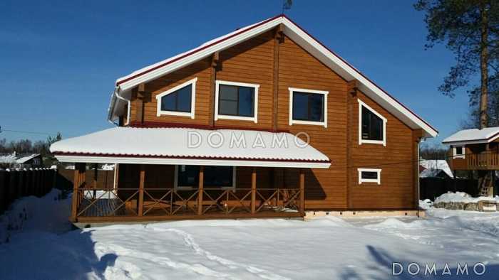 Проект деревянного дома из клееного бруса с встроенным гаражом