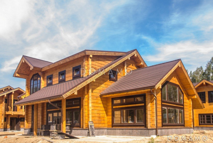 Проект двухэтажного дома из клееного бруса с изолированной кухней-столовой