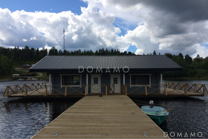 Проект деревянного дома из клееного бруса с крытой террасой расположенной по всему периметру дома