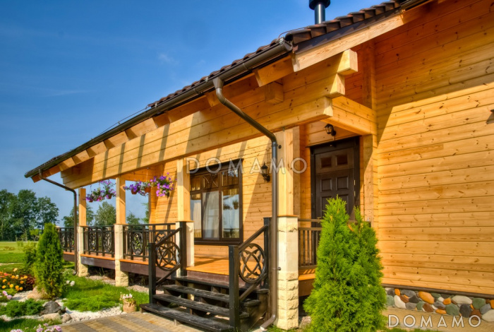 Проект двухэтажного дома из клееного бруса с бассейном и сауной на первом этаже