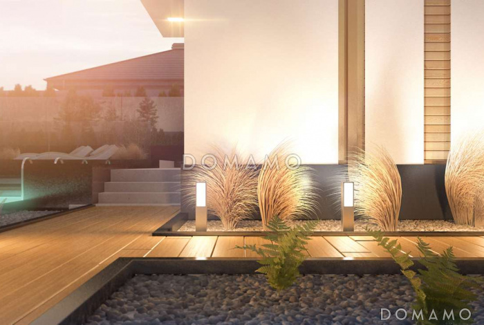 Проект современного комфортного двухэтажного дома из газобетона для двух семей с квартирами на разных этажах и общим гаражом с двумя въездами